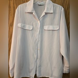 Dressy ladies white, slightly sheer button up, top. Long sleeves with buttons.
